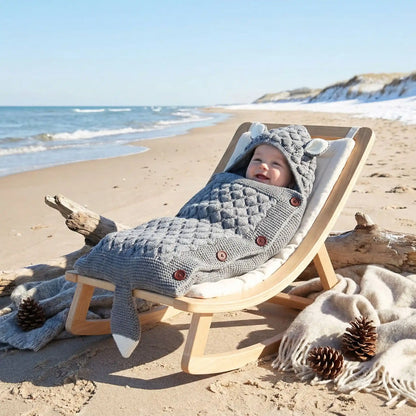 bebe à la plage dans nid d ange bebe doux et confortable